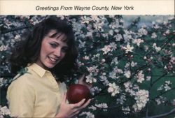 Woman with Apple in Blossom Orchard, Wayne County, NY Postcard