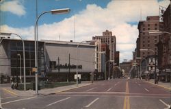 Monroe Avenue with Stores, Banks, Hotels Postcard