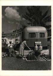 1951 Couple with Travel Trailer & Garden, Bradenton, Florida Postcard