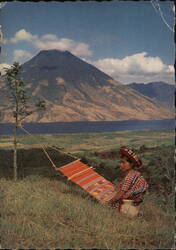 Weaver with Hammock, Lake Atitlán & Volcano Postcard