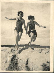 Games on the Beach: Two Women Jumping Postcard