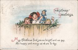 Christmas Greetings with Three Children Peeking Over Fence and Doll Postcard
