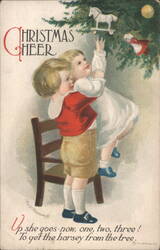Children Reaching for Toy Horse on Christmas Tree Postcard