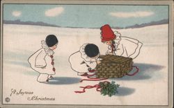 Children in Snow with Christmas Basket and Holly, A Joyous Christmas Postcard