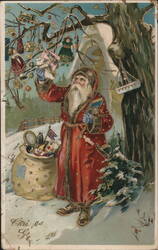 Santa Claus Decorating a Snowy Christmas Tree with Toys and Dolls Postcard