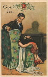 Man Leaning Over Woman in Armchair Under Mistletoe, God Jul Postcard