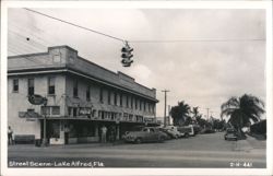 Lake Alfred Florida Main Street Scene with Renall Drugs and City Cafe Postcard