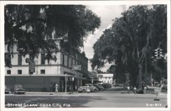 Downtown Dade City, Florida Street Scene with Businesses and Cars Postcard