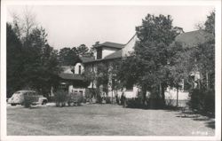 Building Exterior with Car Postcard
