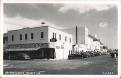 Street Scene - Stuart Rexall Drugs and Lyric Theatre Postcard