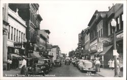 Street Scene with Vintage Cars and Storefronts Postcard