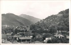 Town of Evarts, nestled in mountain valley Postcard