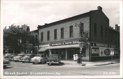 Street Scene with Showers & Hays Drugs, Lion Hotel, Florist, Lincoln Loan Co Postcard