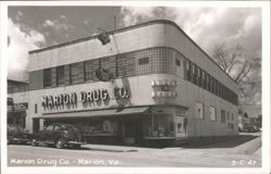 Marion Drug Co., Art Deco Corner Building with Vintage Cars Postcard