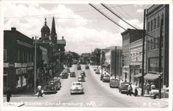Downtown Street Scene with Vintage Cars and Storefronts Postcard