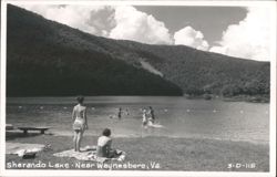 People swimming and sunbathing at Sherando Lake Postcard