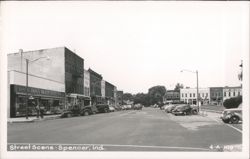 Street Scene with Vintage Cars and Storefronts Postcard