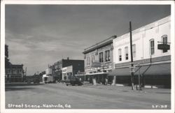 Street Scene with Union Pharmacy and Hotel Postcard