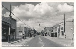 Street Scene with Vintage Cars and Storefronts Postcard