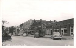 Street Scene with Vintage Cars and Storefronts Postcard