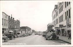 Street Scene with Vintage Cars and Storefronts Postcard