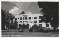 Lee-Land Hotel with Vintage Cars Parked in Front Postcard