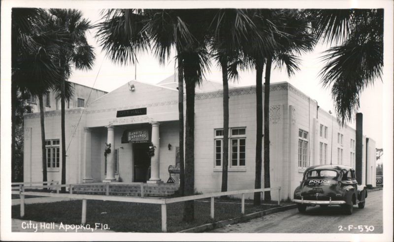 Apopka City Hall with Police Car and 'Bandits of the Badlands' Movie Poster Florida