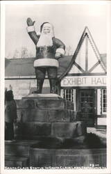 Giant Santa Claus Statue with Child and Exhibit Hall Postcard