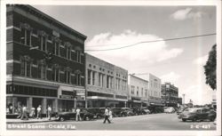 Street Scene with Vintage Cars and Businesses Postcard
