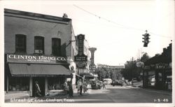 Street Scene with Clinton Drug Co. and various businesses Postcard