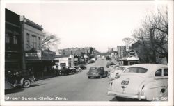Street Scene with Clinton Theatre, Hoskins Drugs, and Vintage Cars Postcard