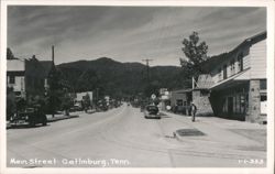 Main Street with Vintage Cars and Shops Postcard