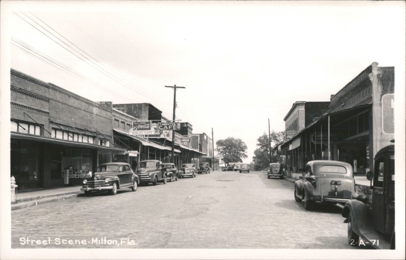Street Scene with Mable's Cafe, Krentzman's Department Store, and Cars Milton Florida