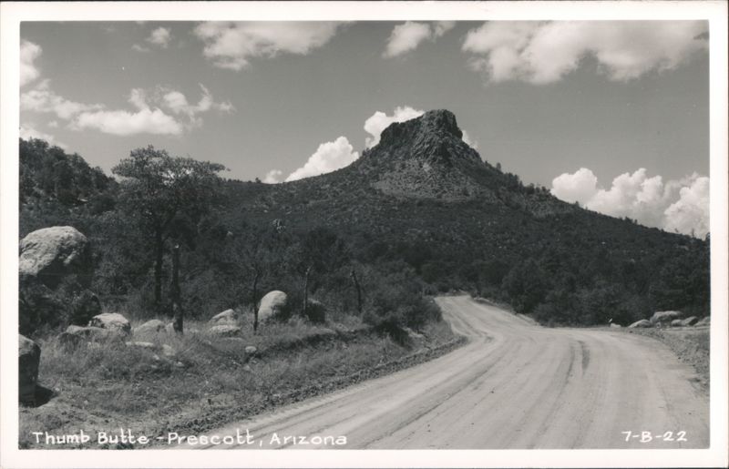 Thumb Butte with Winding Dirt Road and Clouds Prescott Arizona