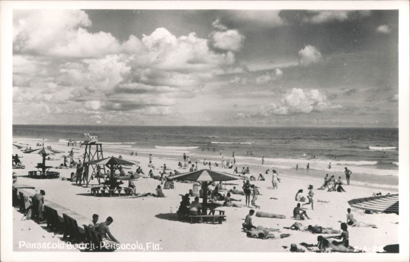 Crowded Beach Scene with Swimmers, Sunbathers, and Umbrellas Pensacola Florida