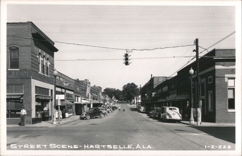 Street Scene with Cars, Businesses, and Traffic Light Hartselle Alabama