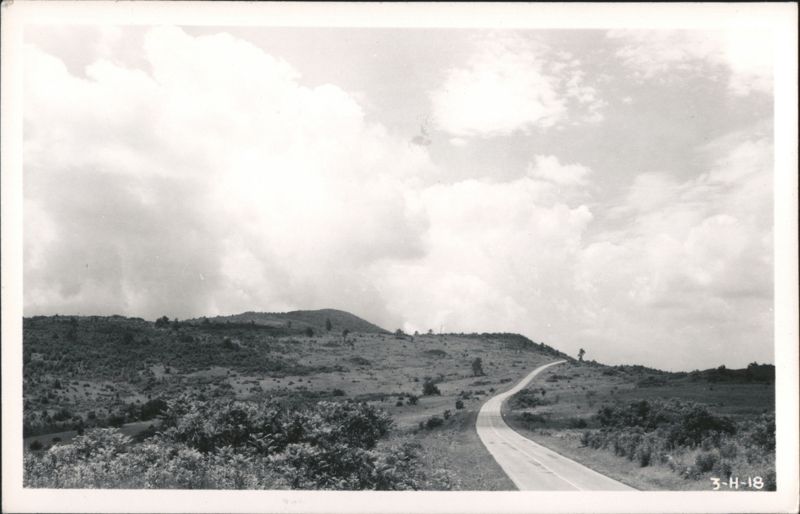 Winding Road through Hilly Landscape under Cloudy Sky Virginia