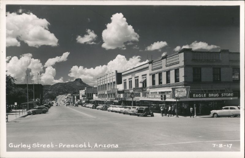 Gurley Street, downtown street scene with cars, businesses, and mountains Prescott Arizona