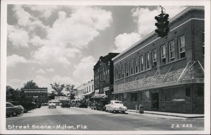 Street Scene with Cars, Businesses, and Traffic Light Milton Florida