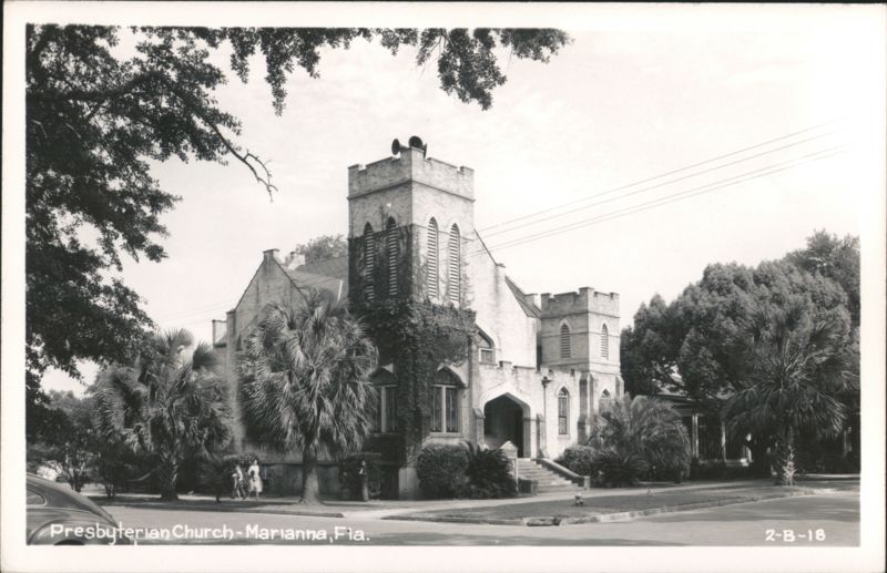Presbyterian Church building with tower, palm trees, and ivy Marianna Florida