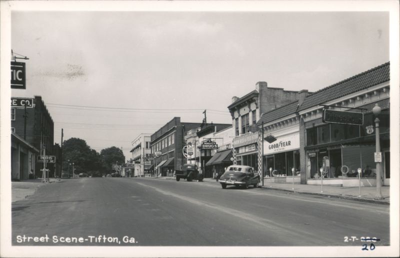 Main Street with Goodyear, Firestone, Wright's Drugs, Sears stores Tifton Georgia
