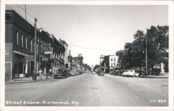 Downtown Street Scene with Madison Drugs, Style Mart, and Vintage Cars Postcard