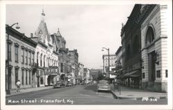 Main Street streetscape with Capitol Drugs, Frankfort Hotel, and Farmers Bank Postcard