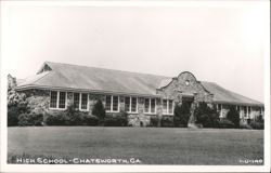 Historic Stone High School Building with Gabled Roof and Arched Entrance Postcard