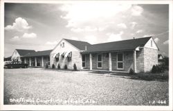 Sheffield Court Motel with Stone Facade and Parked Cars Postcard