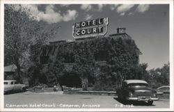 Cameron Hotel Court building covered in ivy with two cars Postcard