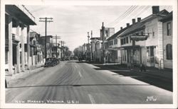 Main Street View with Businesses, Parked Cars, US 11 Postcard