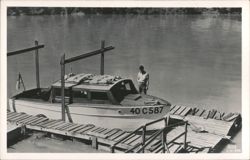 Chris-Craft Motorboat 40 C 587 on river ramp with man Postcard
