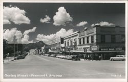 Gurley Street, downtown street scene with cars, businesses, and mountains Postcard