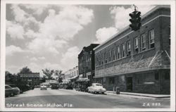 Street Scene with Cars, Businesses, and Traffic Light Postcard